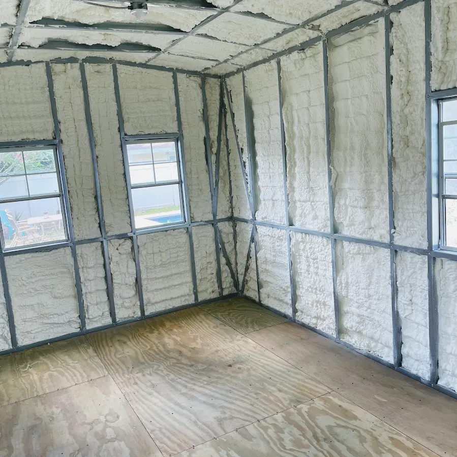 Closed-cell spray foam insulation applied to wall cavities in a residential project in Clifton